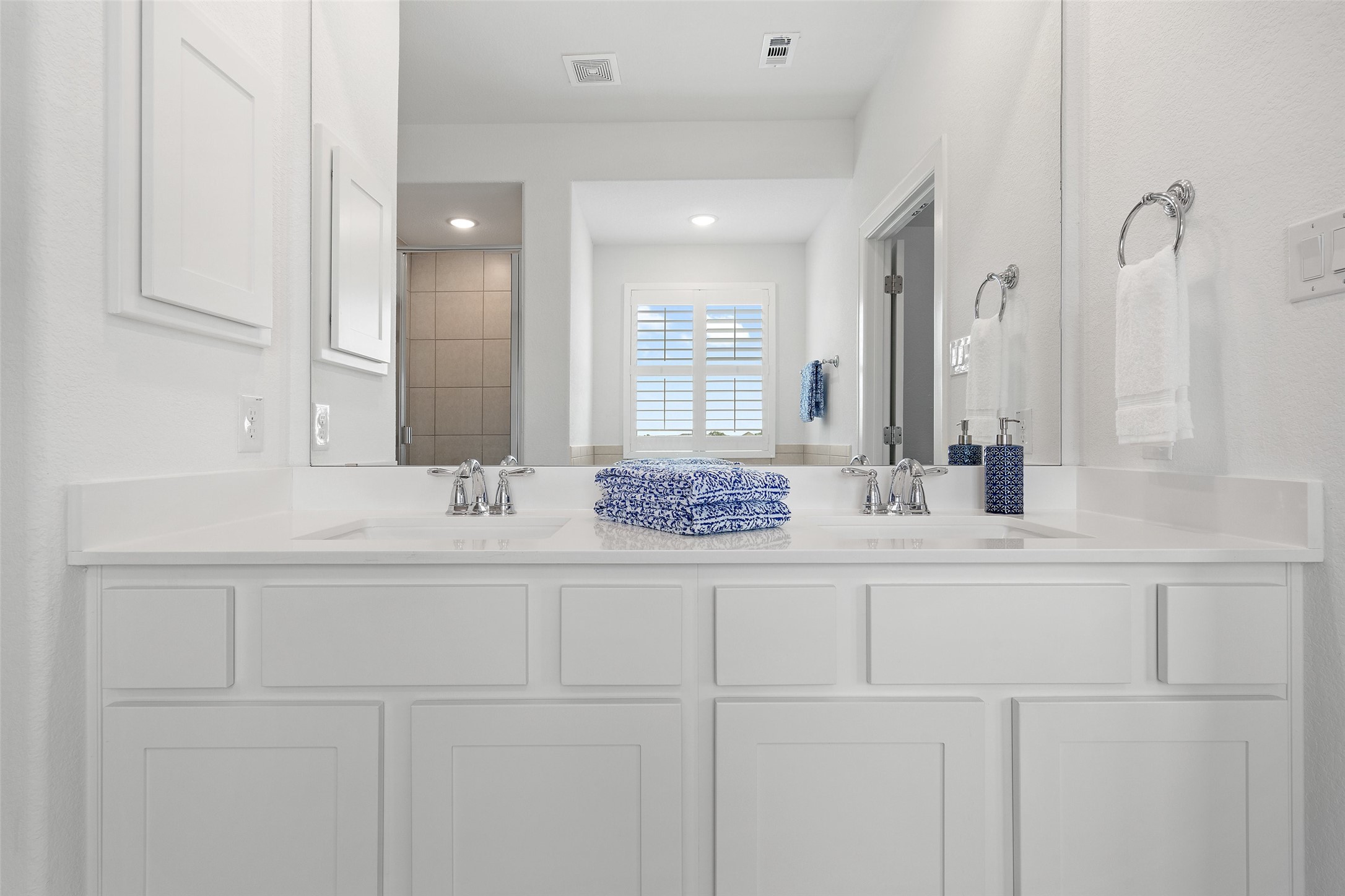 604 Pecan Bottom Trail Georgetown, TX 78628 - Photo 22 of 40 a bathroom with a sink vanity and mirror