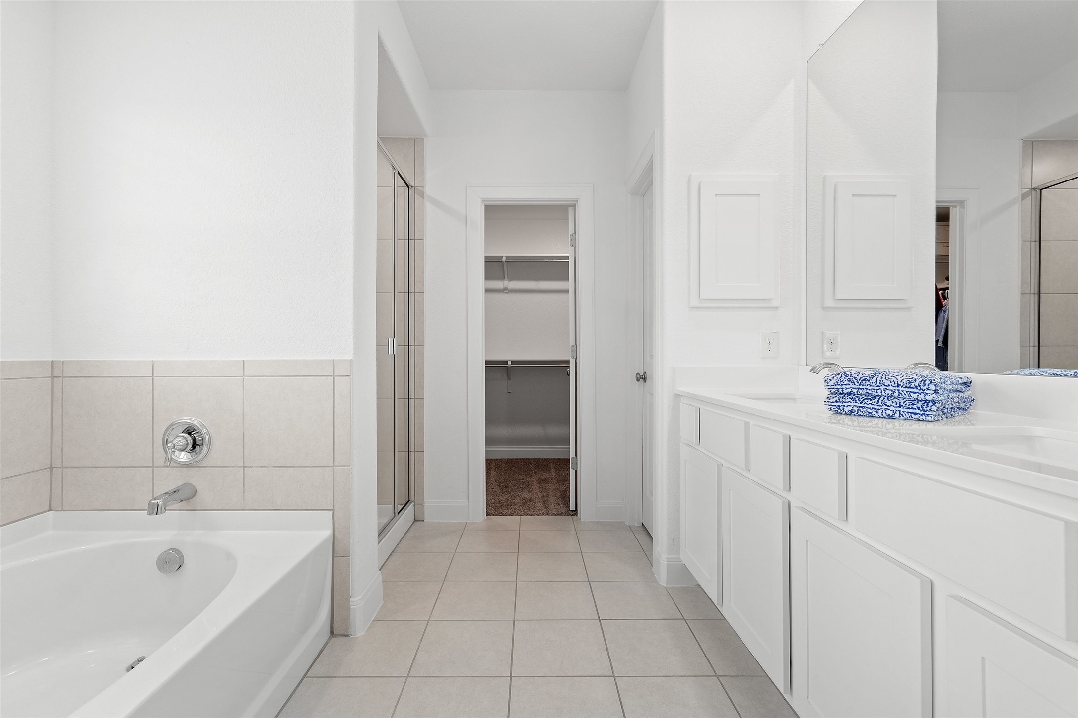 604 Pecan Bottom Trail Georgetown, TX 78628 - Photo 23 of 40 a bathroom with a tub shower and sink