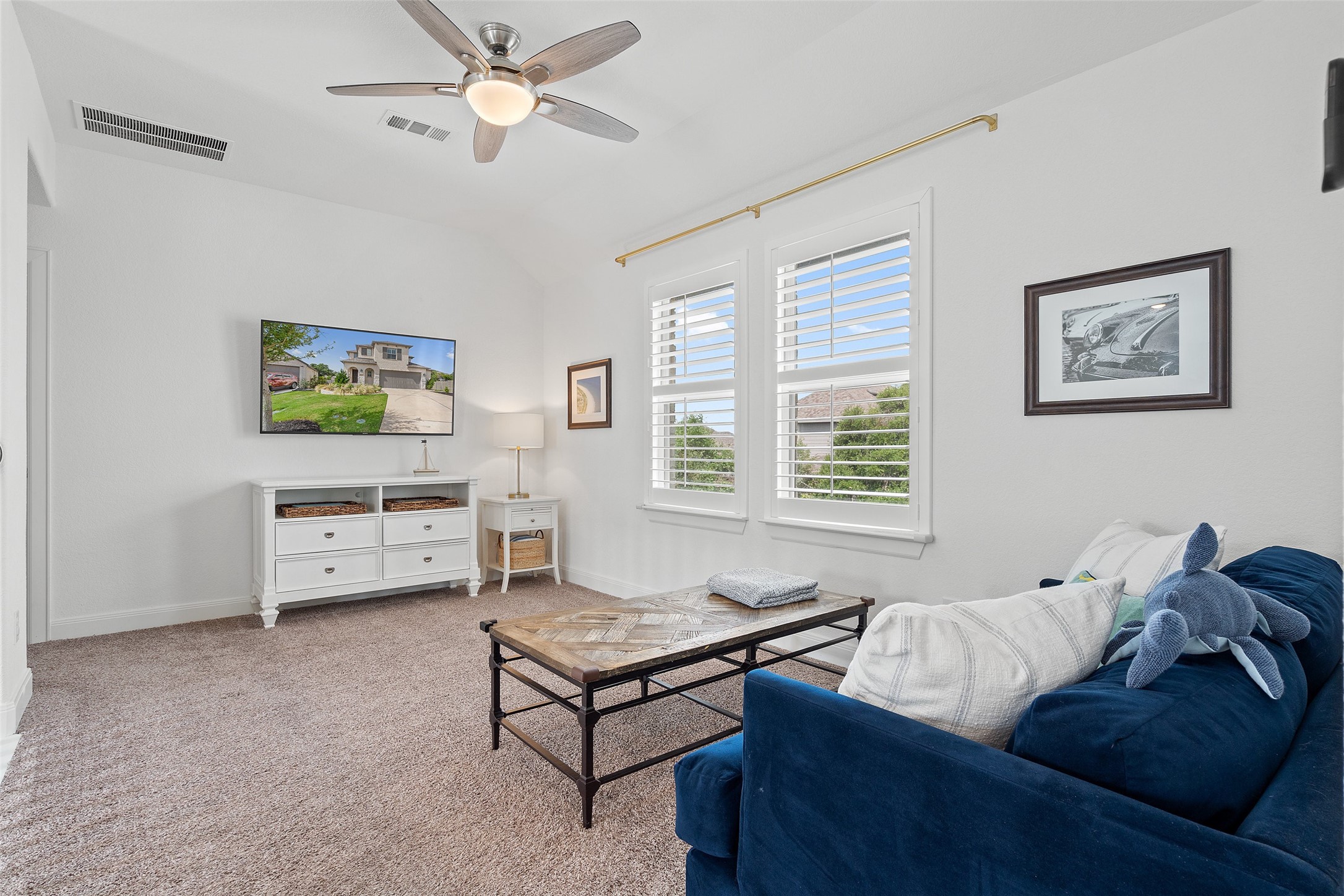 604 Pecan Bottom Trail Georgetown, TX 78628 - Photo 28 of 40 Carpeted living area featuring a ceiling fan and lofted ceiling