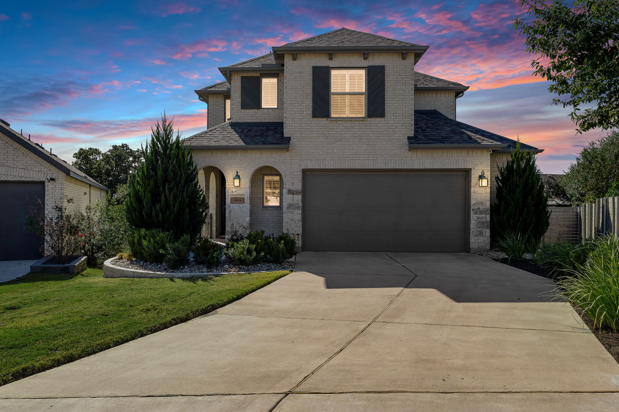 604 Pecan Bottom Trail Georgetown, TX 78628 - Photo 3 of 40 a front view of a house with a yard