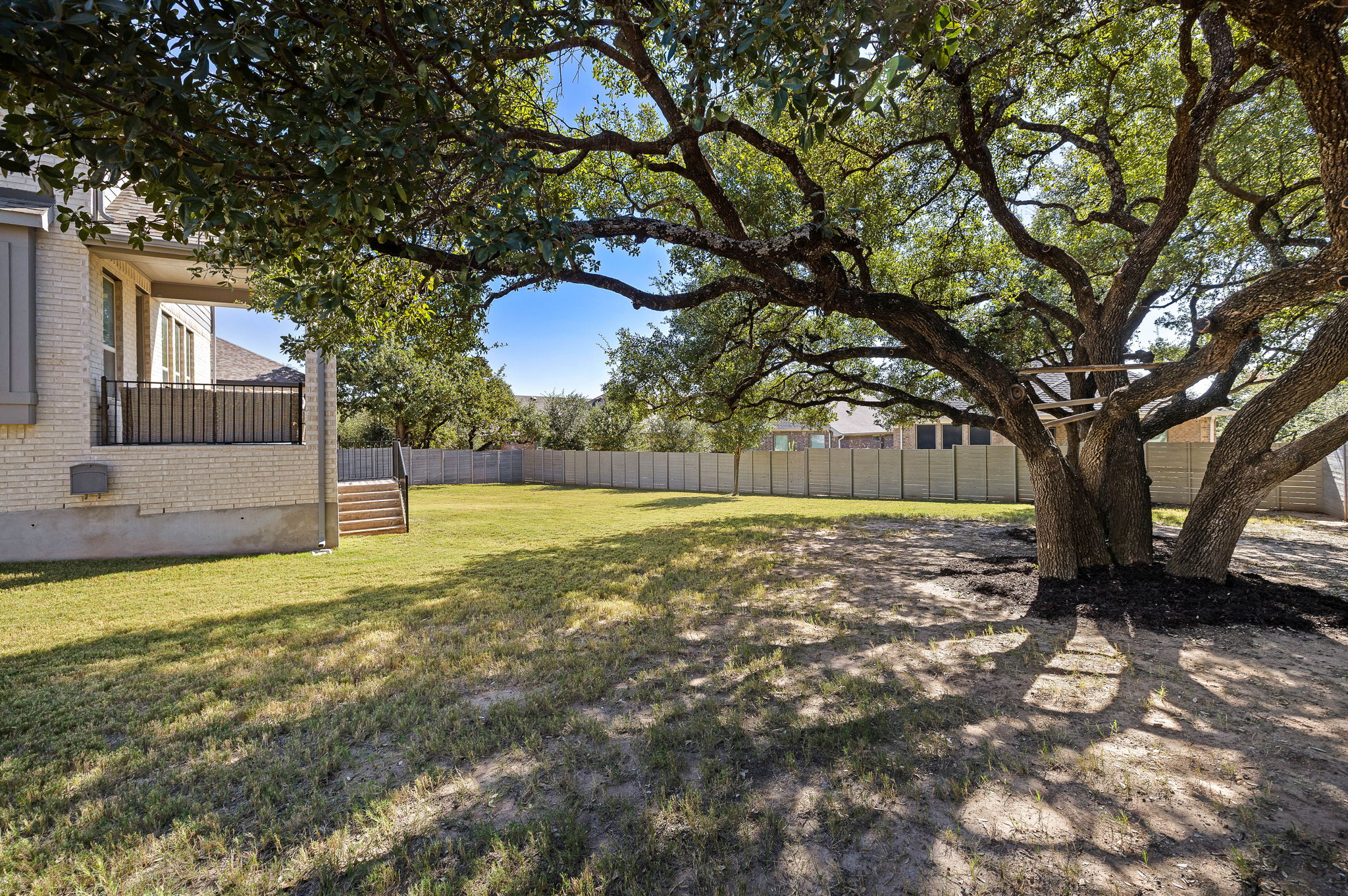 604 Pecan Bottom Trail Georgetown, TX 78628 - Photo 33 of 40 a view of a yard with a tree
