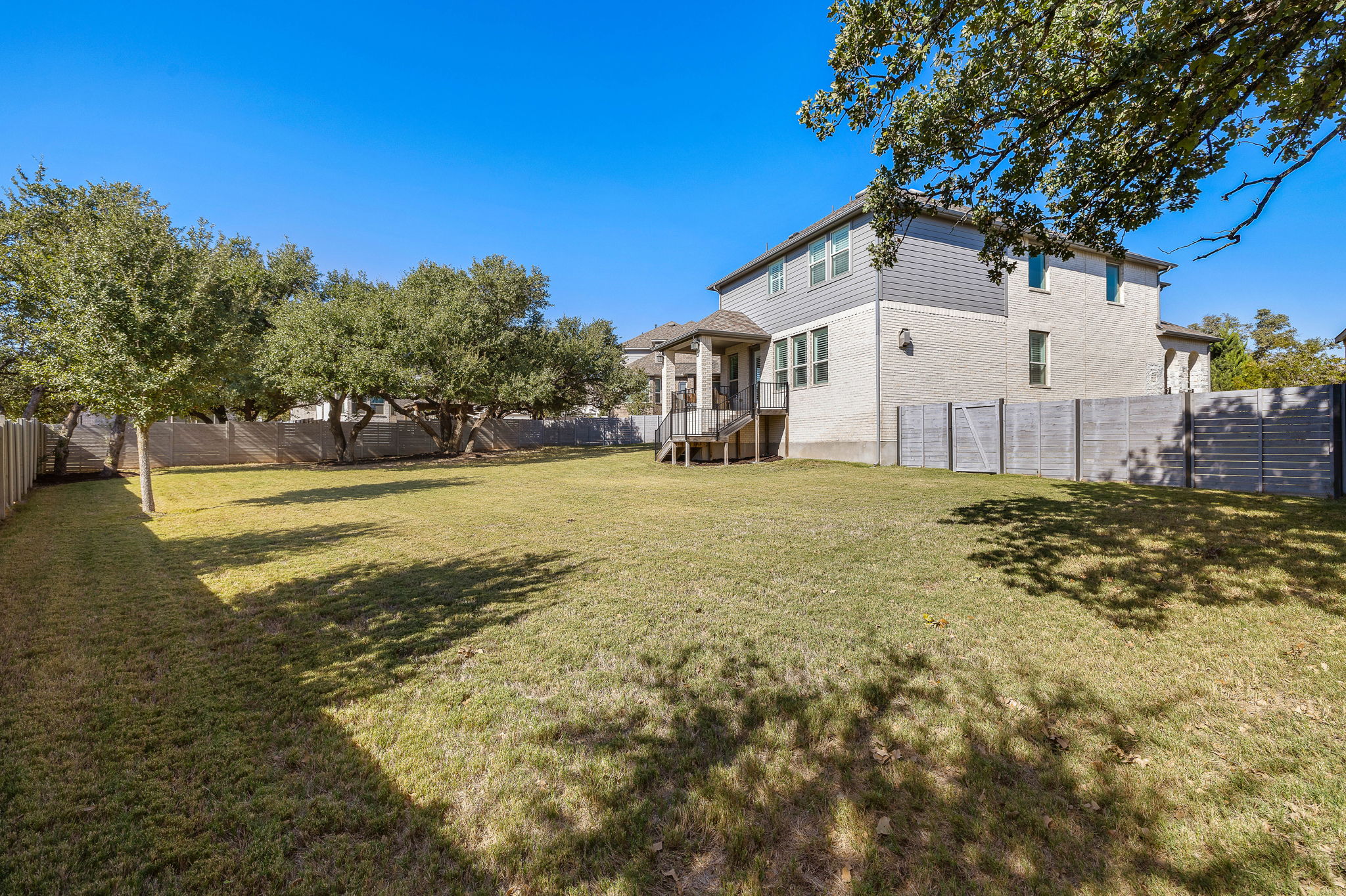 604 Pecan Bottom Trail Georgetown, TX 78628 - Photo 34 of 40 a view of a house with a yard