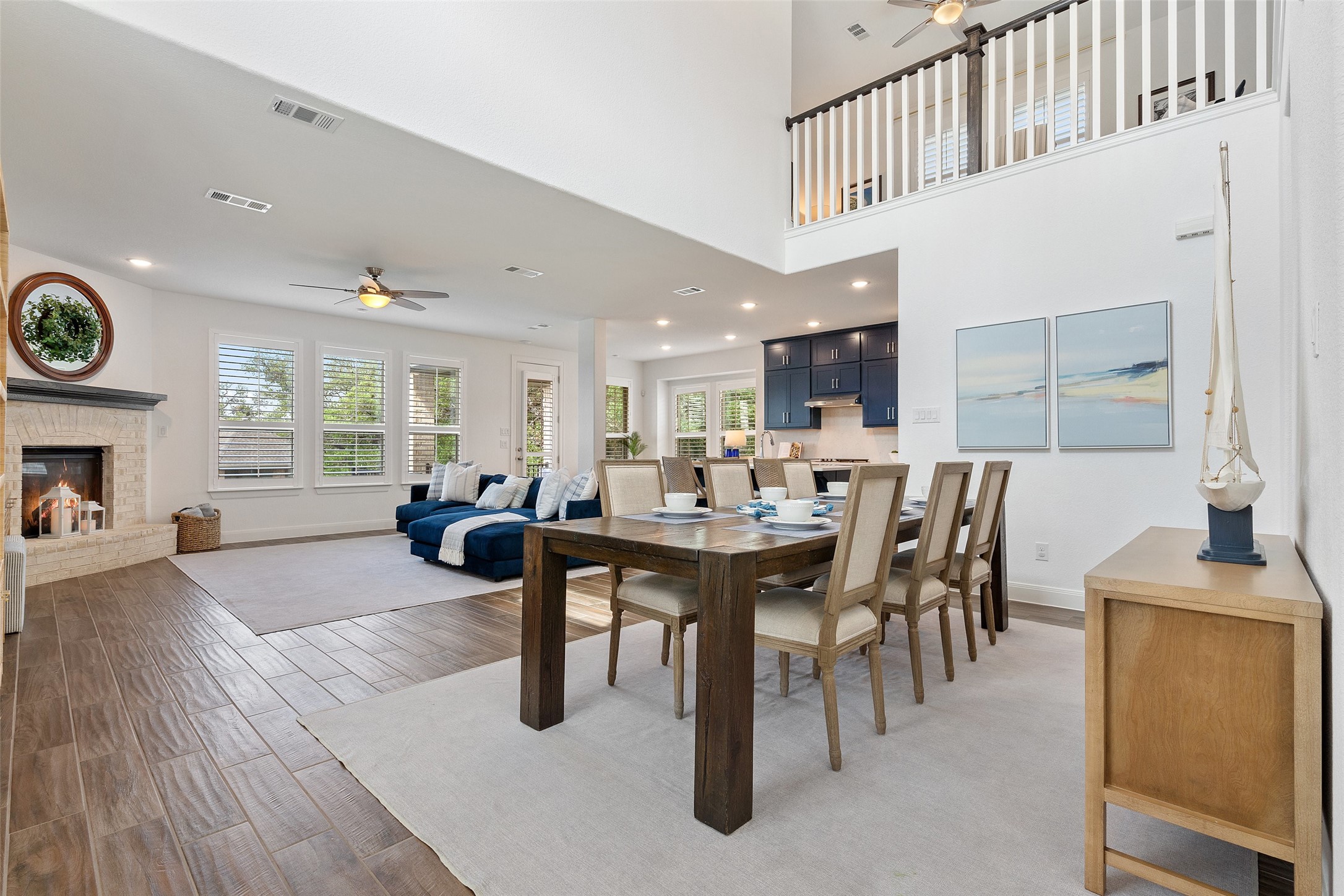 604 Pecan Bottom Trail Georgetown, TX 78628 - Photo 7 of 40 a living room with furniture a fireplace and a table