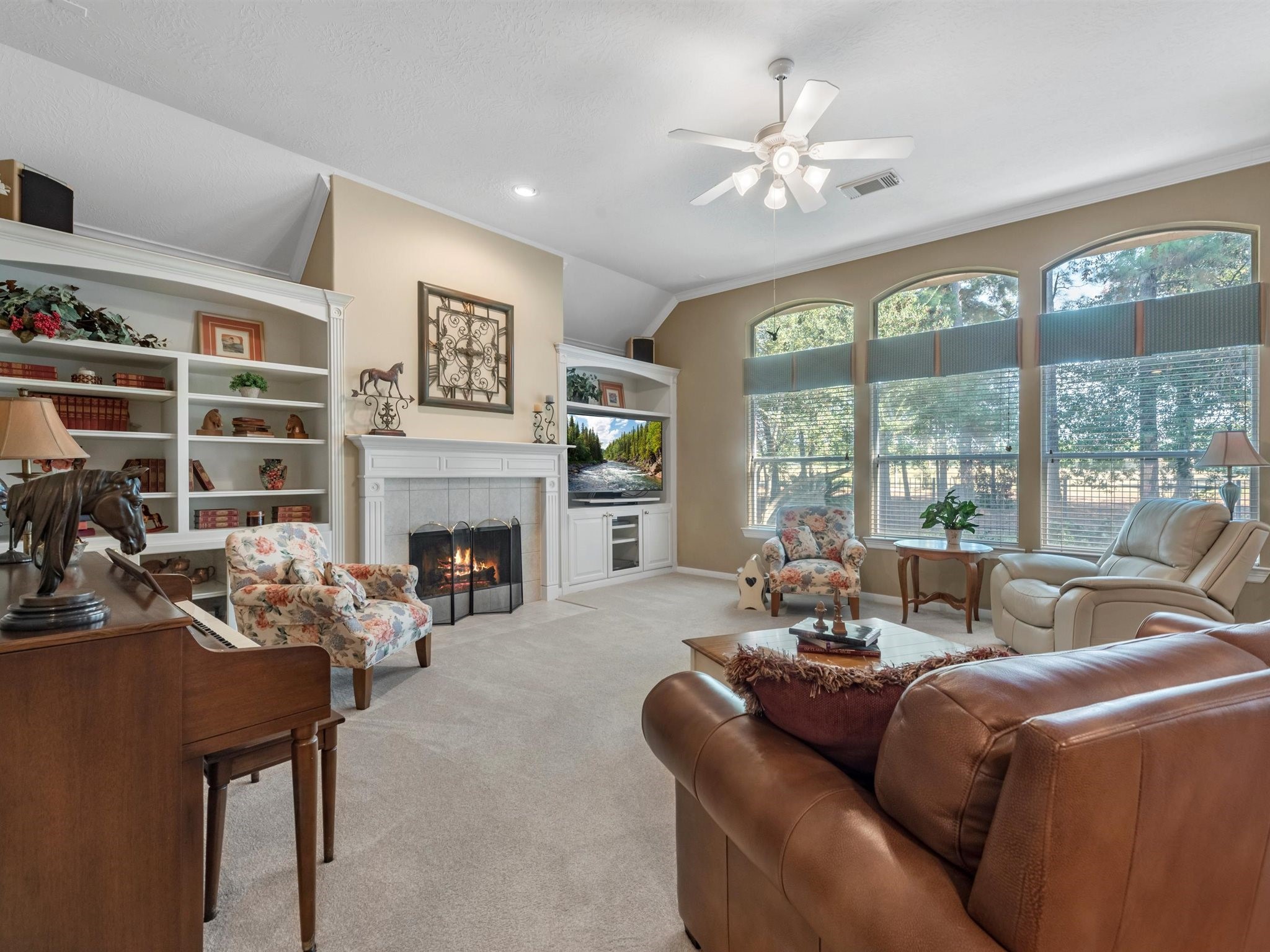 20471 Bentwood Oaks Drive Porter, TX 77365 - Photo 11 of 43 a living room with furniture a fireplace and a large window