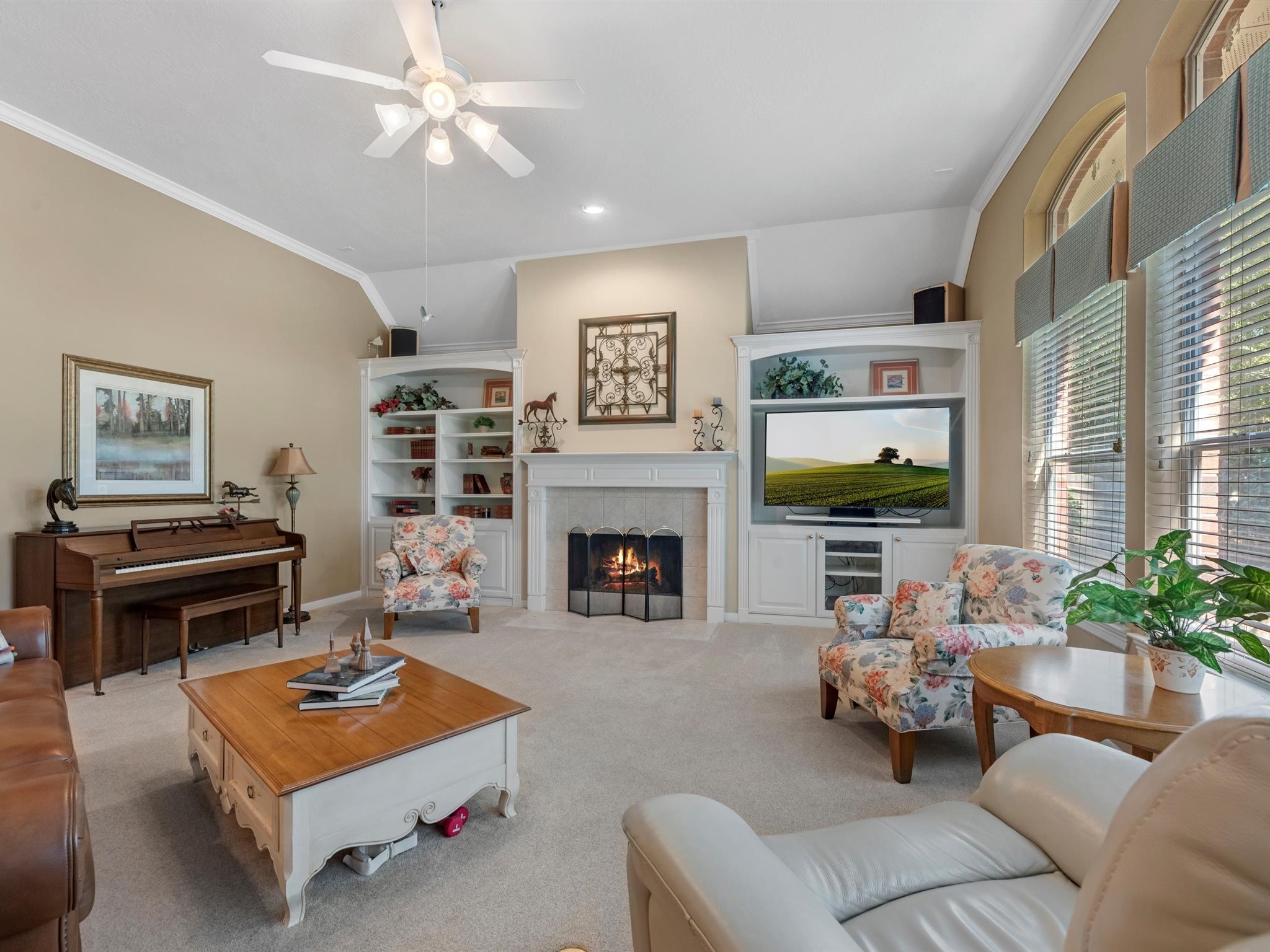 20471 Bentwood Oaks Drive Porter, TX 77365 - Photo 12 of 43 a living room with furniture a fireplace and a flat screen tv
