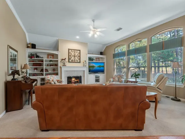 a bathroom with a glass shower door and a mirror