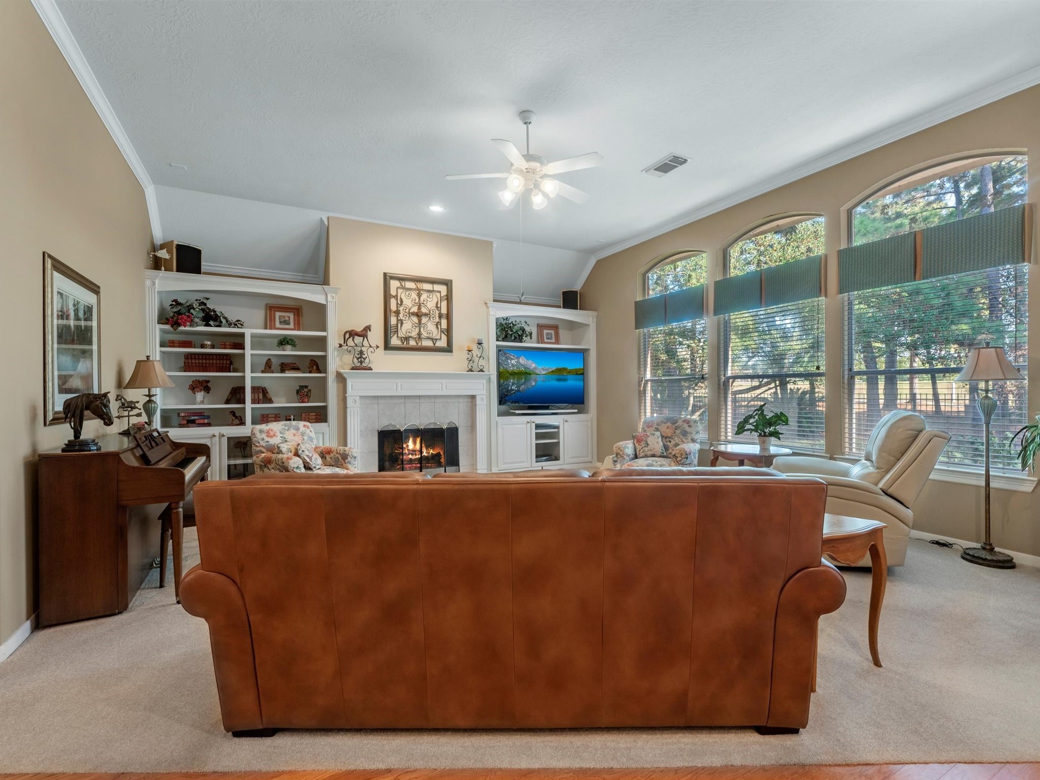 20471 Bentwood Oaks Drive Porter, TX 77365 - Photo 14 of 43 a living room with furniture a fireplace and a large window