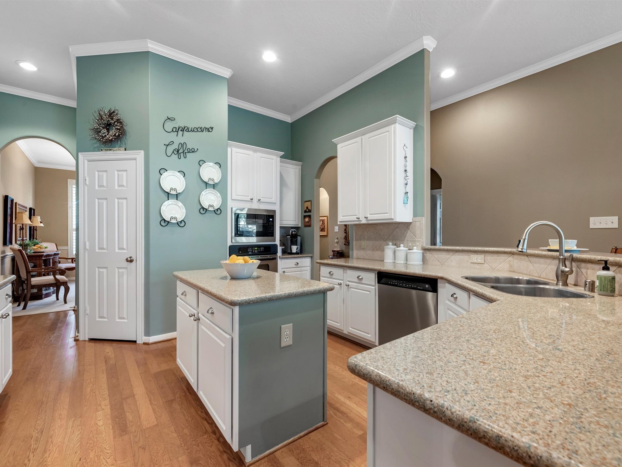 20471 Bentwood Oaks Drive Porter, TX 77365 - Photo 16 of 43 a kitchen with granite countertop a sink stove and cabinets
