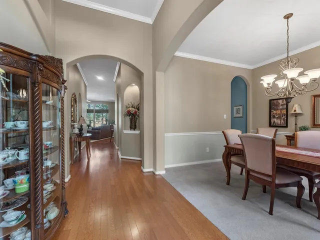 a kitchen with stainless steel appliances granite countertop a sink and a stove