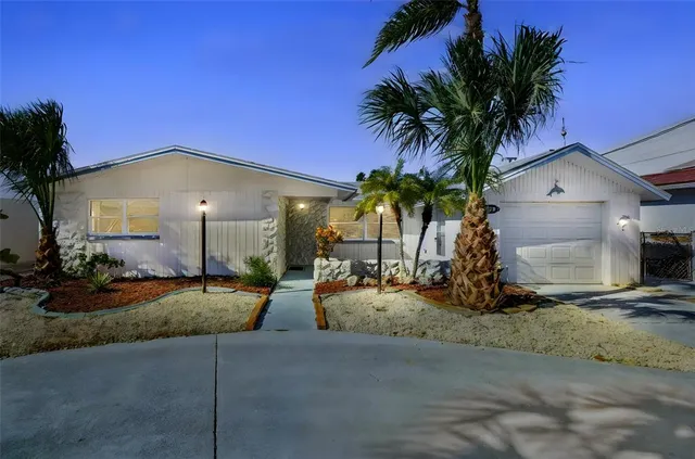 a view of a house with outdoor space and sitting area