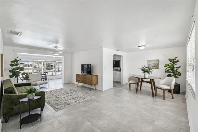 a kitchen with a sink a stove and cabinets