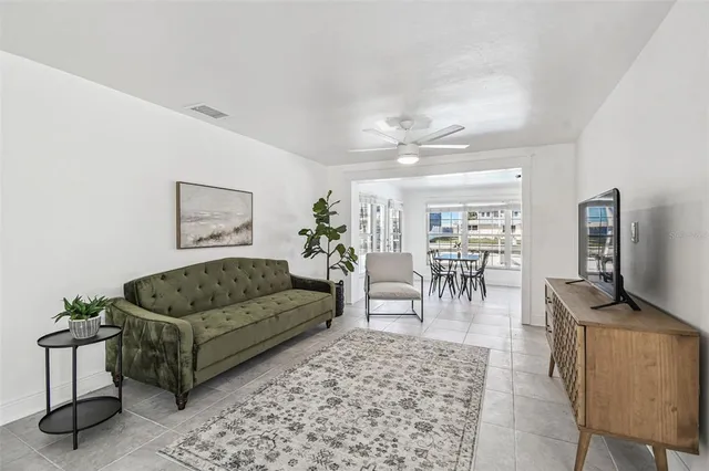 a bedroom with a bed and ceiling fan