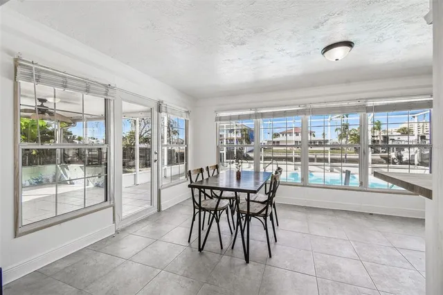 a bedroom with a bed a mirror and desk