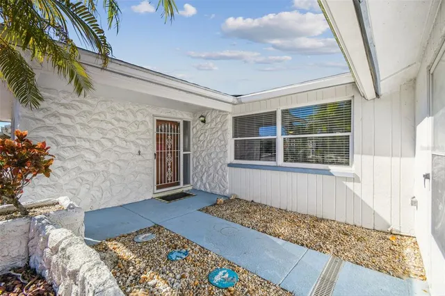 a front view of house with yard and seating space