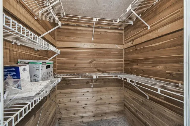 a view of a swimming pool with outdoor seating