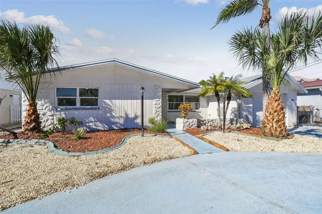 a dining room with furniture and windows