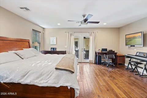 a bed room with furniture and a wooden floor