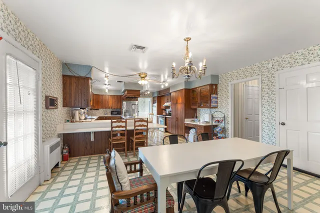 a living room with lots of furniture and wooden floor