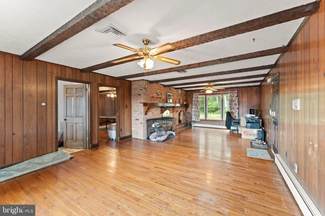 a bedroom with a bed and a desk in it