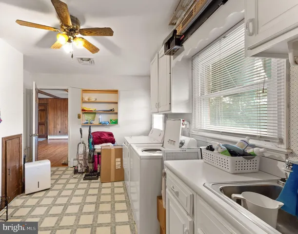 a bathroom with a sink mirror toilet and bathtub