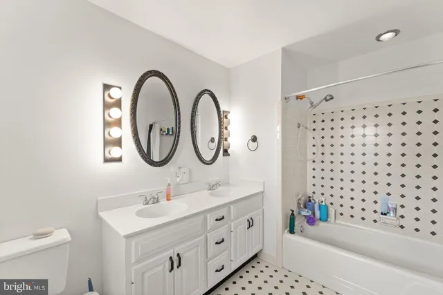 a bedroom with a bed and flat screen tv