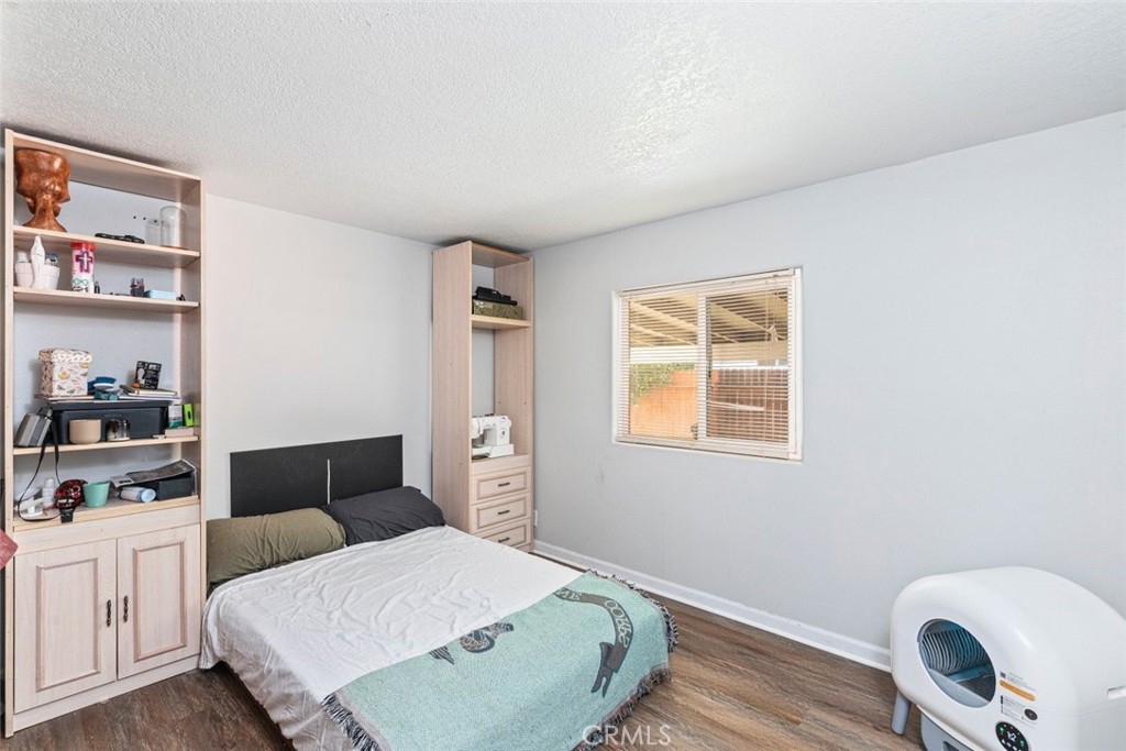 24799 Split Rail Road Wildomar, CA 92595 - Photo 12 of 37 a bedroom with a bed and window