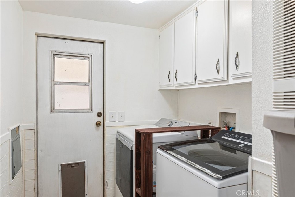 24799 Split Rail Road Wildomar, CA 92595 - Photo 14 of 37 a kitchen with white cabinets and a sink