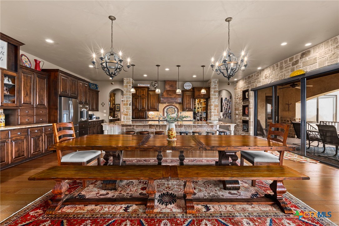 1039 Bluewater Place Spring Branch, TX 78070 - Photo 19 of 48 a large room with lots of chairs and chandelier