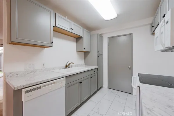 a kitchen with a sink and cabinets