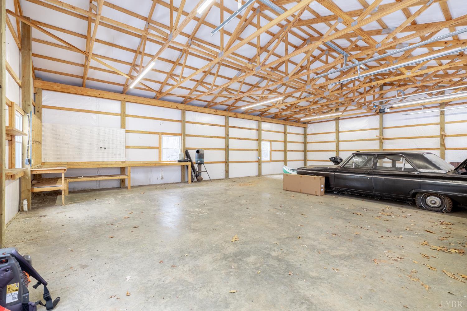 3538 Gladys Road Gladys, VA 24554 - Photo 64 of 81 a view of a garage room with furniture and a garage