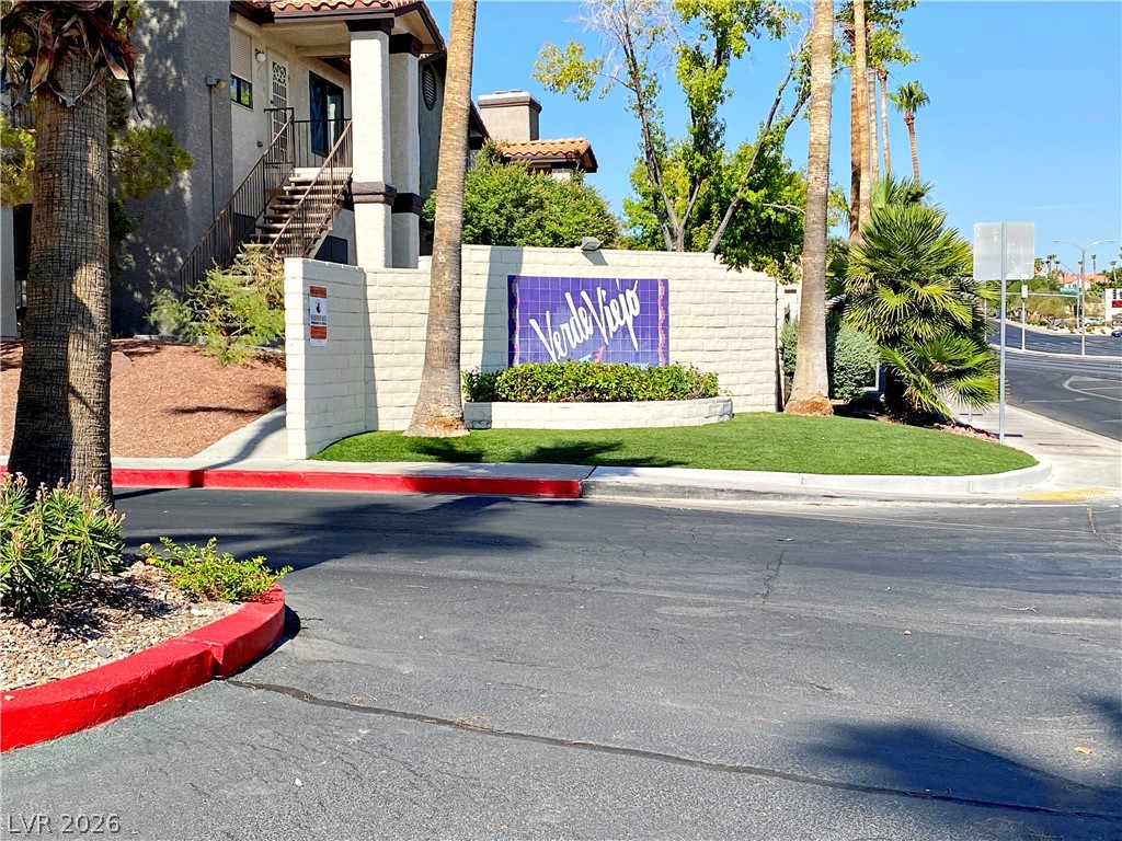 1575 West Warm Springs Road, Unit 1024 Henderson, NV 89014 - Photo 17 of 25 A well-maintained street view entry with lush landscaping welcomes you home.