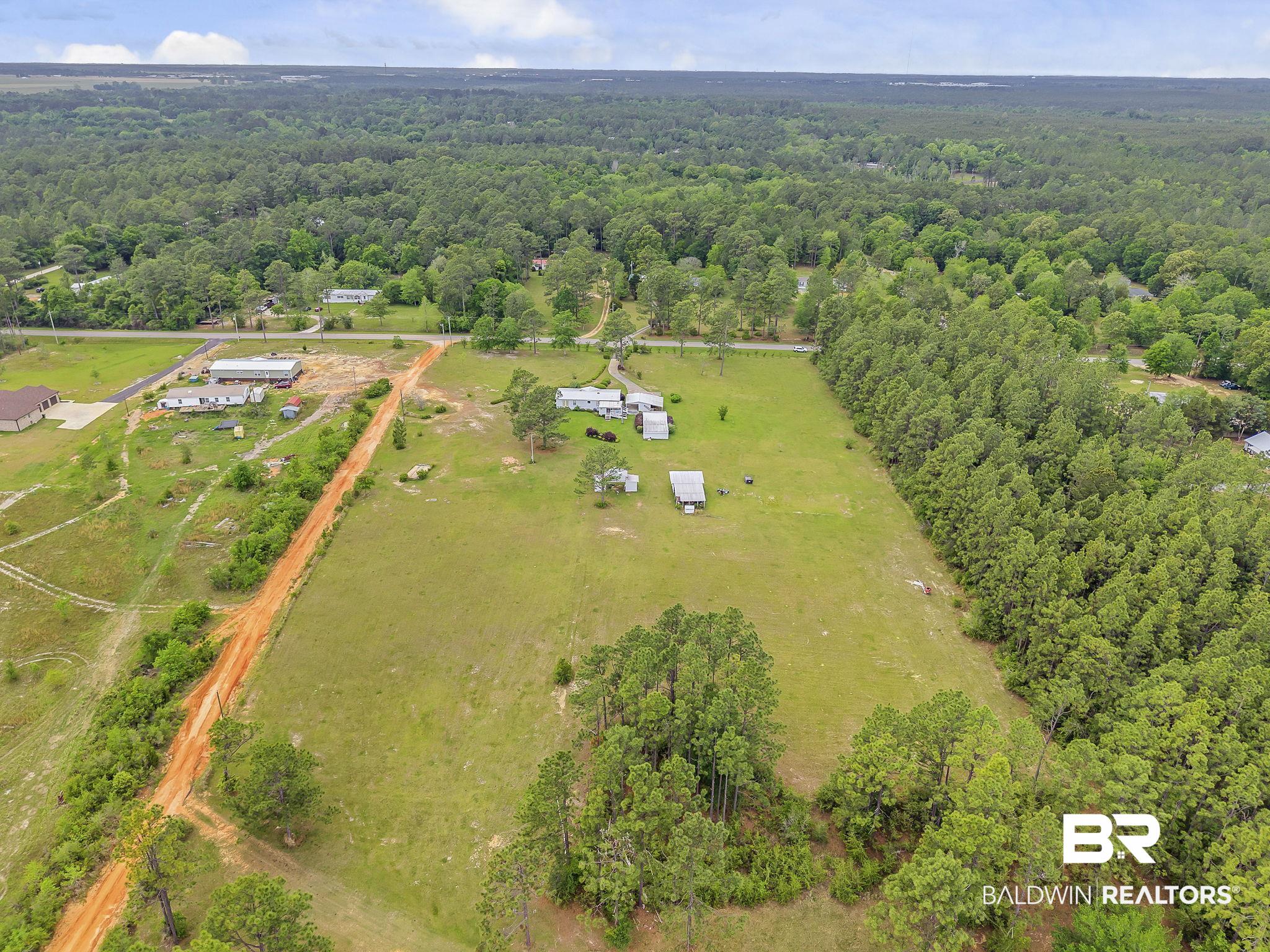 29792 County Road 65 Loxley, AL 36551 - Photo 26 of 39 Birds eye view of property with a wooded view