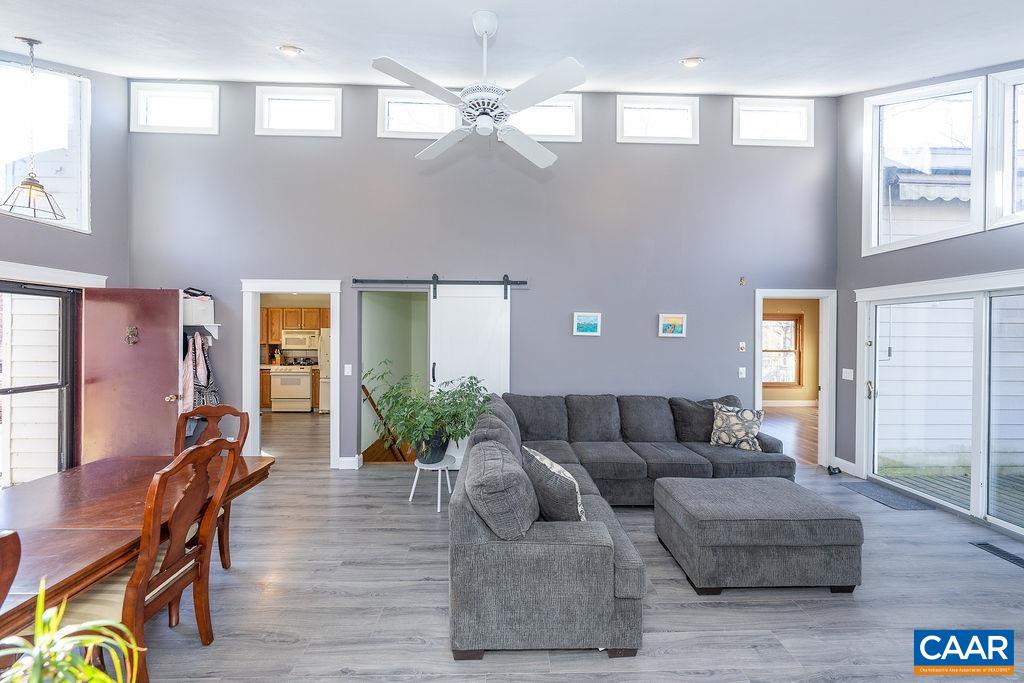 75 Amethyst Road Palmyra, VA 22963 - Photo 22 of 42 a living room with furniture and a chandelier