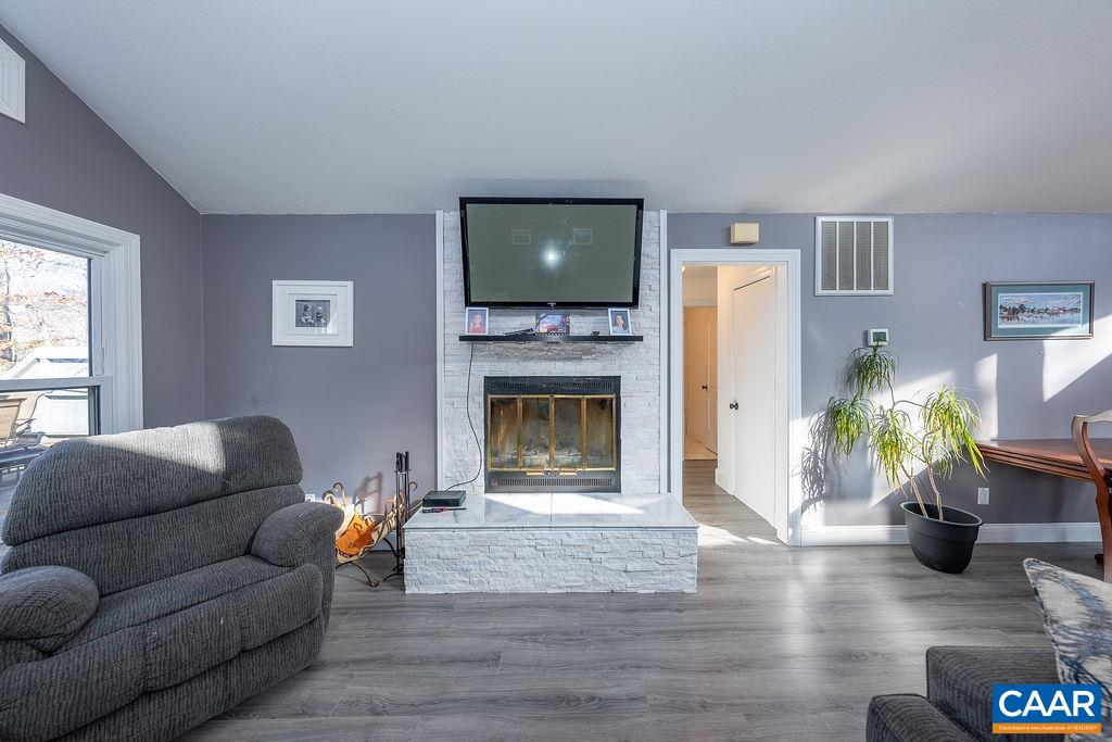 75 Amethyst Road Palmyra, VA 22963 - Photo 24 of 42 a living room with furniture and a fireplace