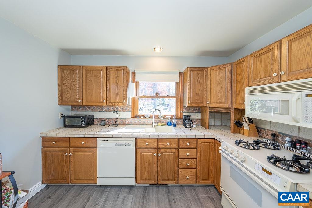 75 Amethyst Road Palmyra, VA 22963 - Photo 26 of 42 a kitchen with a stove a sink and a window