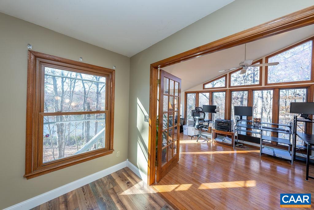 75 Amethyst Road Palmyra, VA 22963 - Photo 29 of 42 a living room with furniture and floor to ceiling windows