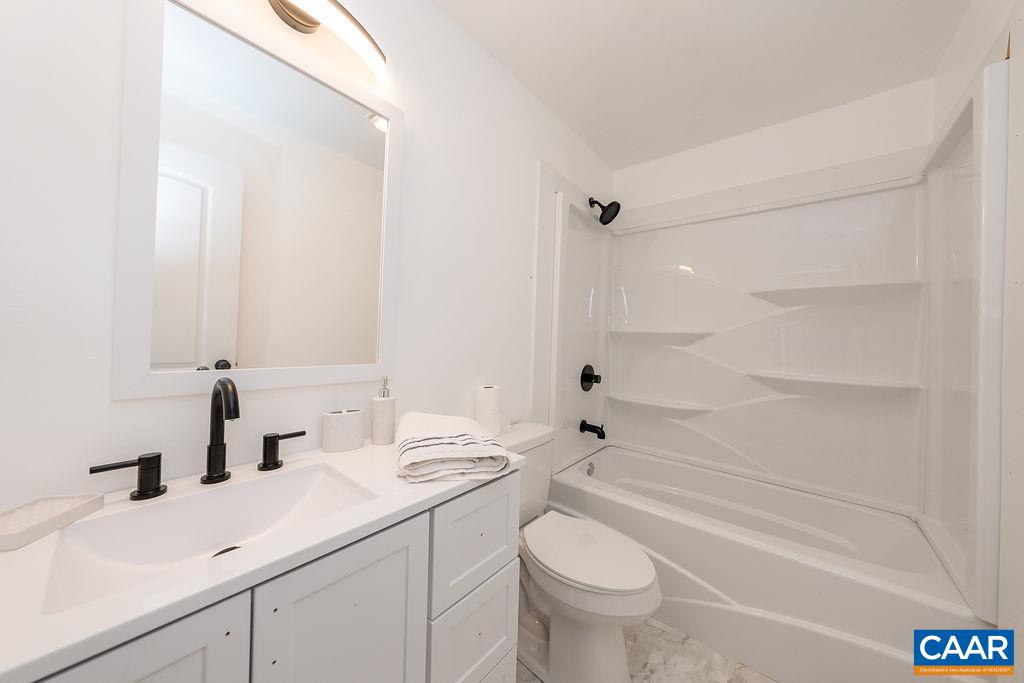 75 Amethyst Road Palmyra, VA 22963 - Photo 36 of 42 a bathroom with a sink a toilet and shower