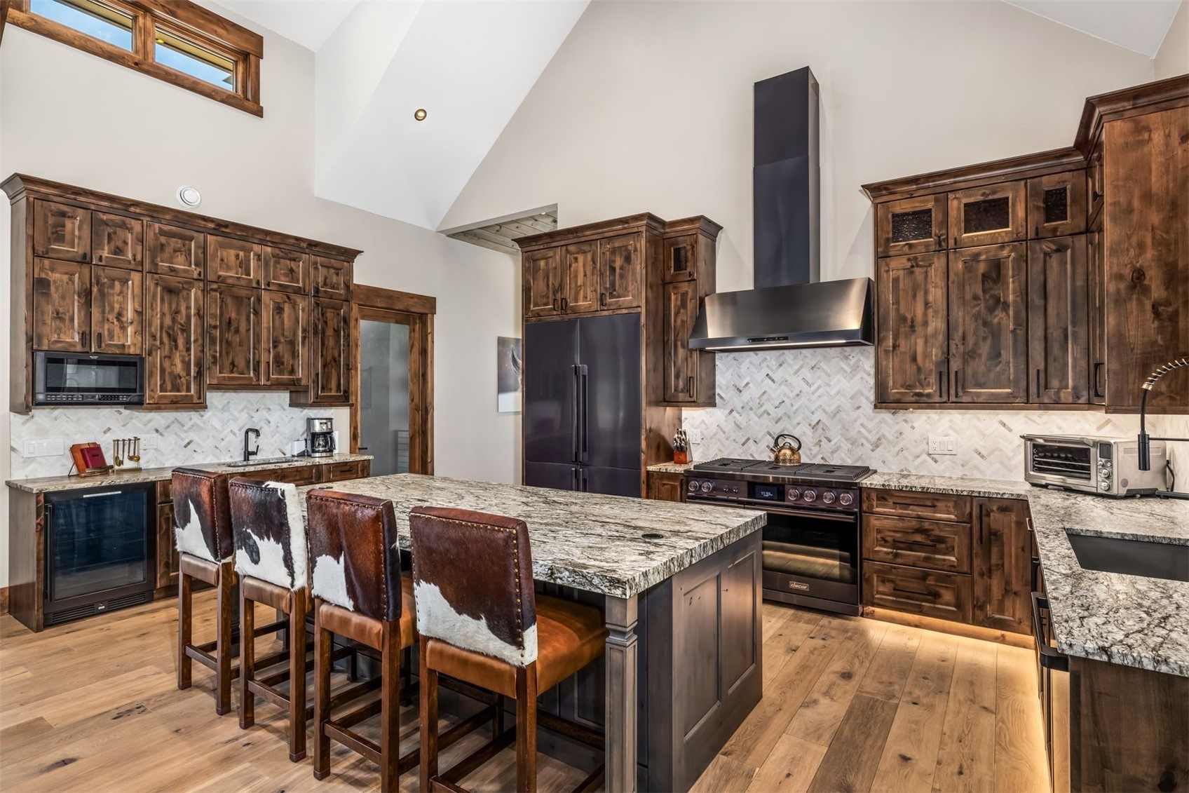 99 Independence Lane Keystone, CO 80435 - Photo 8 of 50 a kitchen with granite countertop stainless steel appliances a sink stove and refrigerator