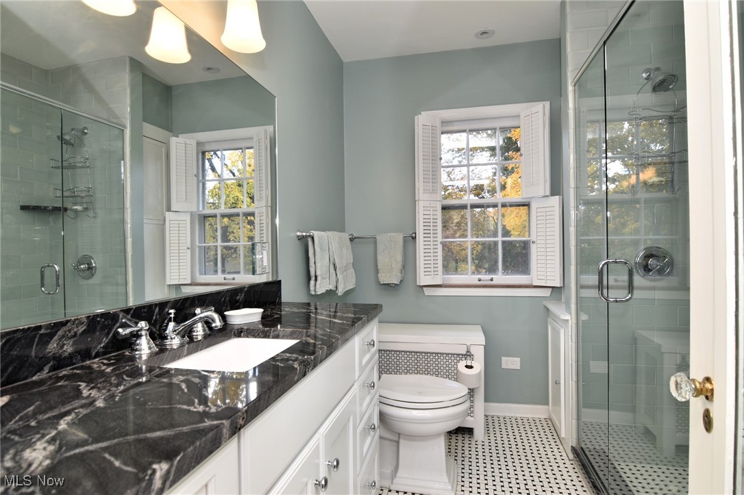 2887 Kingsley Road Shaker Heights, OH 44122 - Photo 18 of 40 The Primary Bath, features a granite countertop, newer fixtures, ceramic tile flooring and a large tile shower