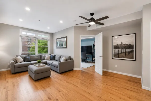 a living room with furniture and a large window