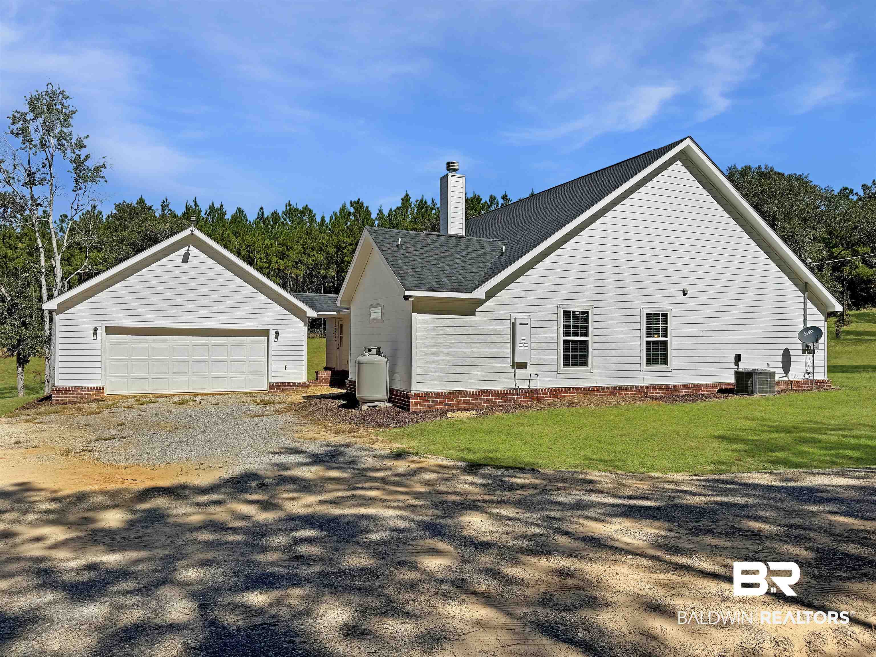 30687 Brady Road Robertsdale, AL 36567 - Photo 39 of 53 South side of the house and entrance to the garage.