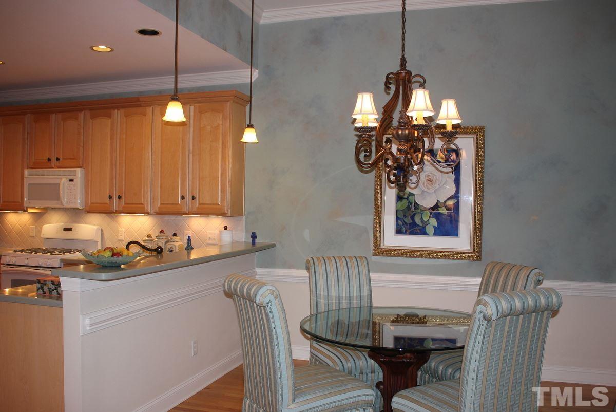 7405 Fontana Ridge Lane Raleigh, NC 27613 - Photo 10 of 25 a dining room with furniture and window