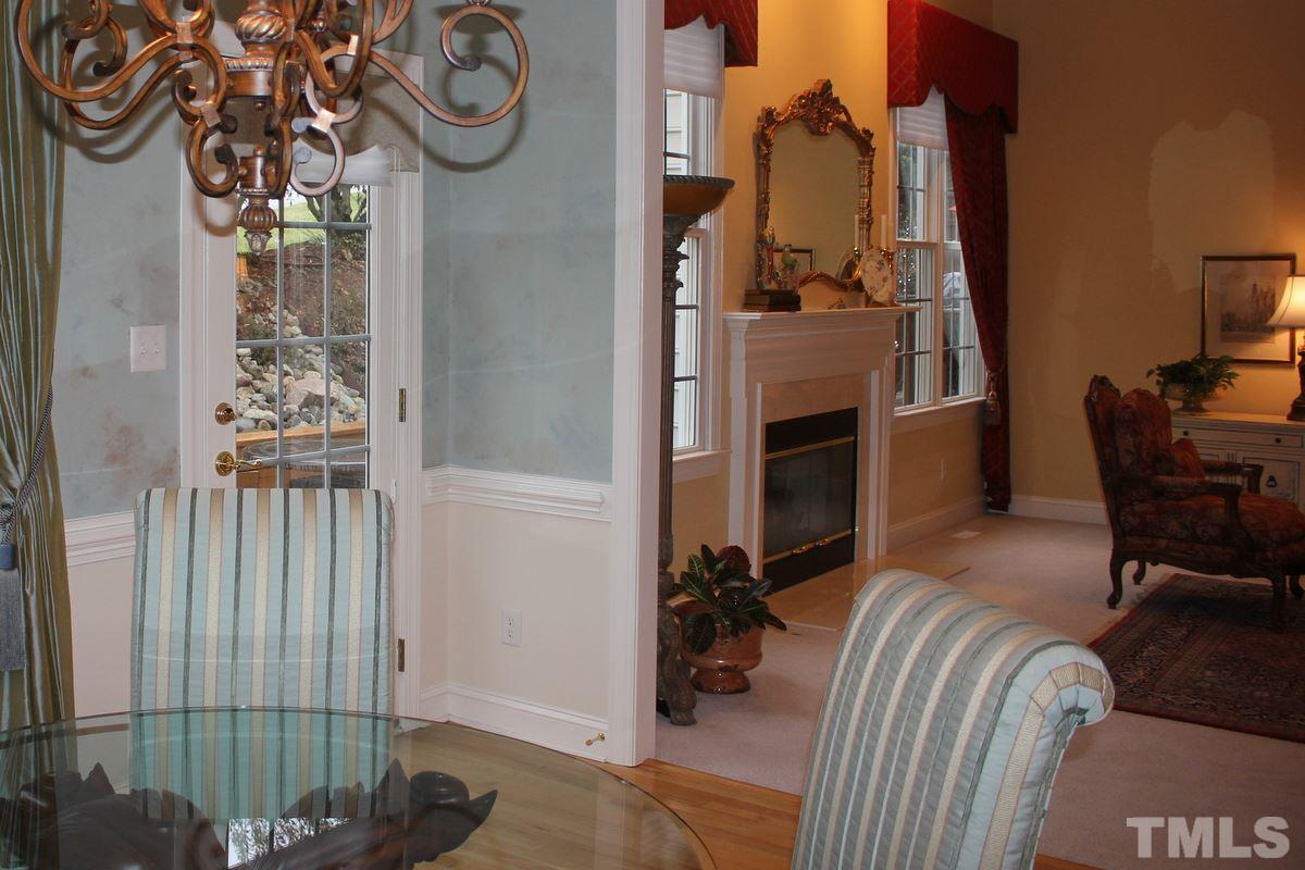7405 Fontana Ridge Lane Raleigh, NC 27613 - Photo 11 of 25 a view of a livingroom with furniture and a ceiling fan