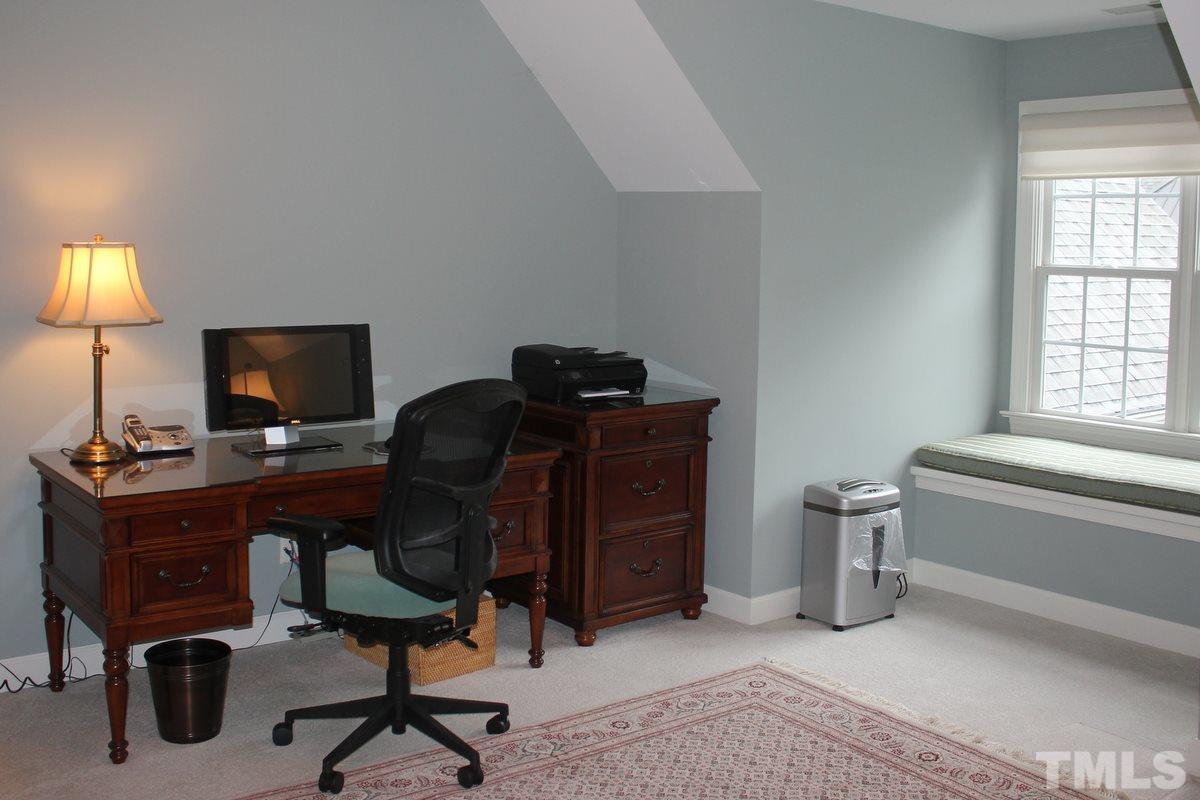 7405 Fontana Ridge Lane Raleigh, NC 27613 - Photo 14 of 25 a view of a workspace with furniture and a window