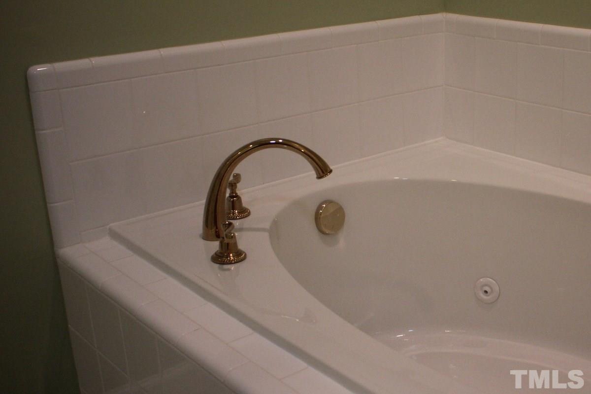 7405 Fontana Ridge Lane Raleigh, NC 27613 - Photo 22 of 25 a close view of a faucet a sink