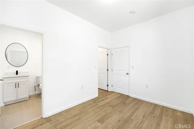 a view of a bathroom with dual sinks