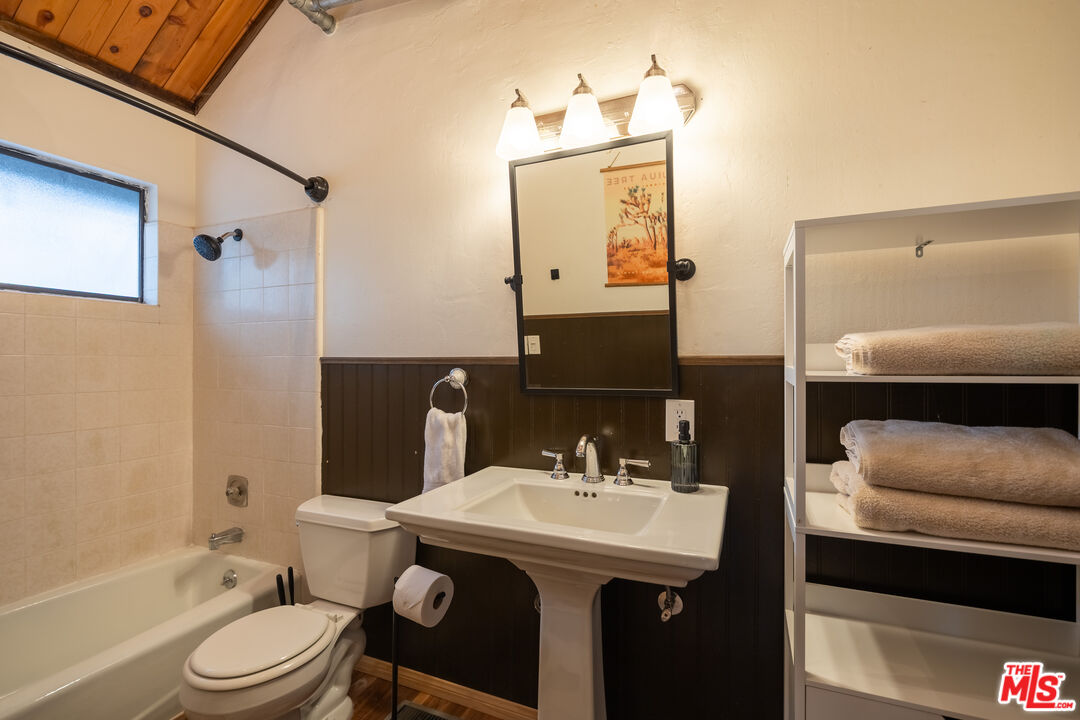 26645 Lake Forest Drive Twin Peaks, CA 92391 - Photo 14 of 30 a bathroom with a sink a toilet and shower