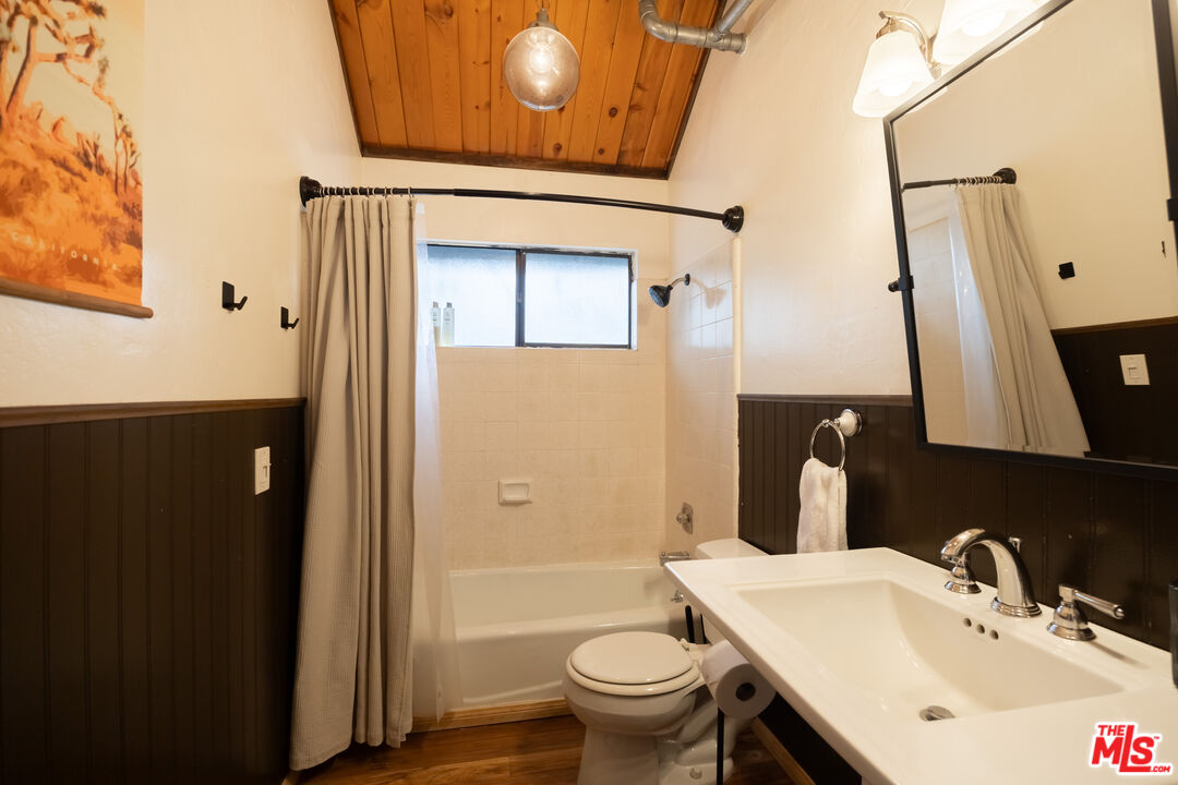 26645 Lake Forest Drive Twin Peaks, CA 92391 - Photo 15 of 30 a bathroom with a sink and a mirror
