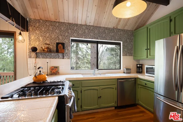 a kitchen that has a sink and a stove