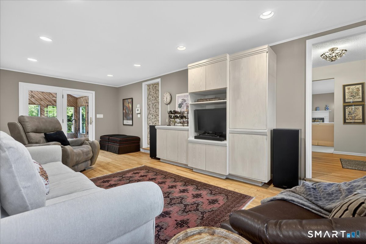 11 Bender Road Hamden, CT 06518 - Photo 13 of 40 a living room with furniture and a rug